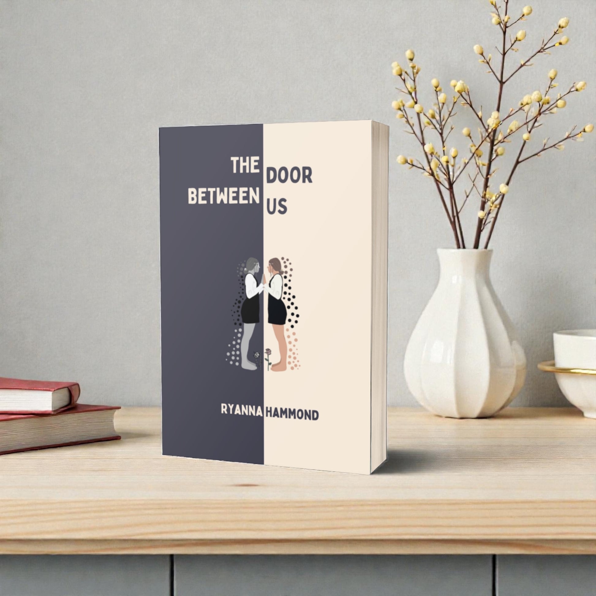 A book cover titled The Door Between Us.