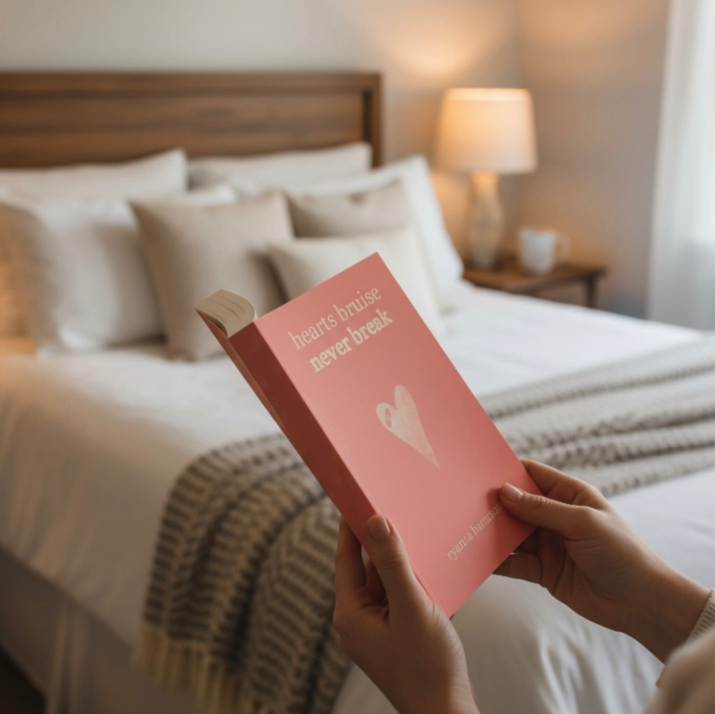 A poetry book cover titled Hearts Bruise Never Break.