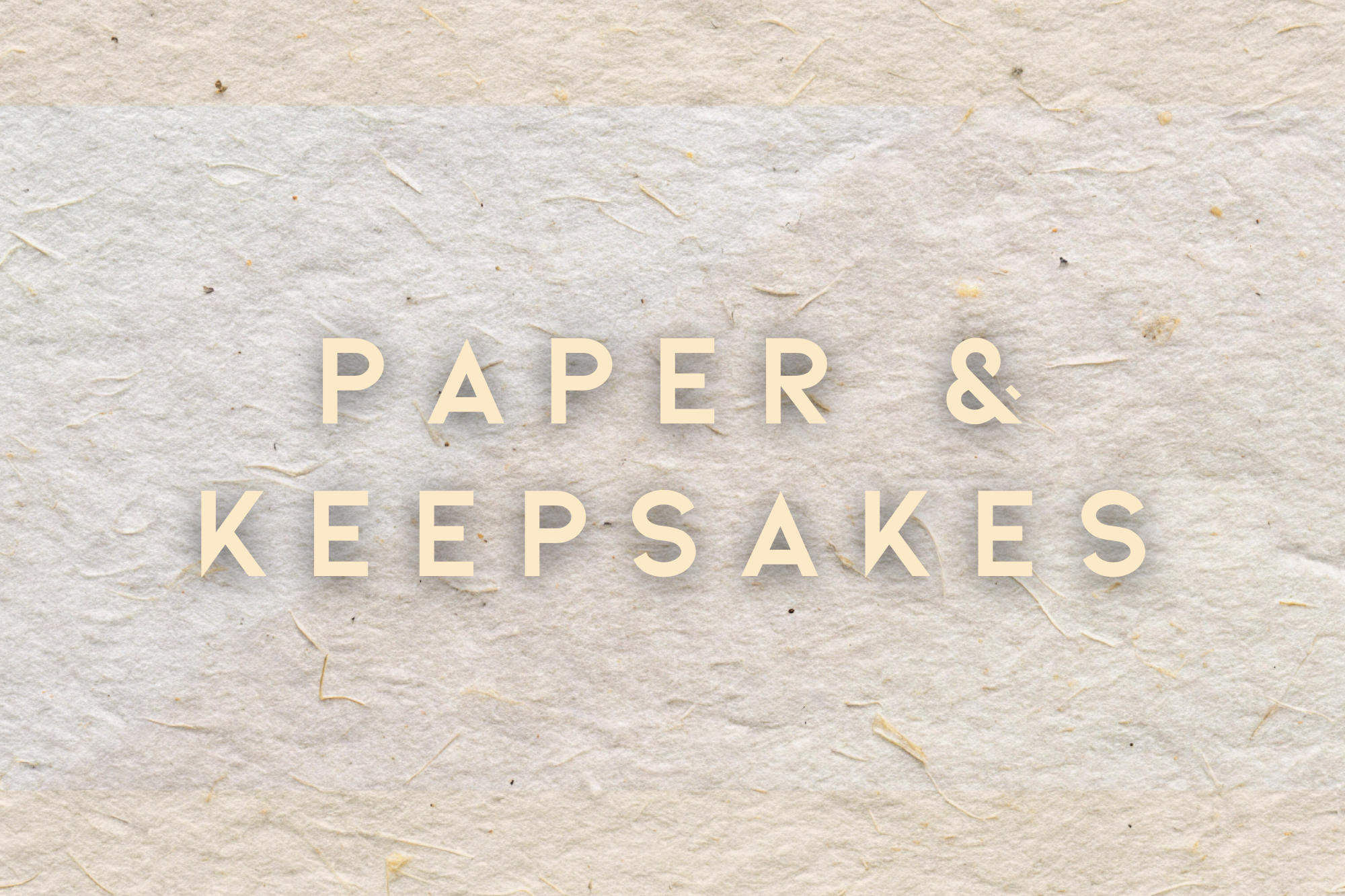 Text 'PAPER & KEEPESAKES' on textured paper background