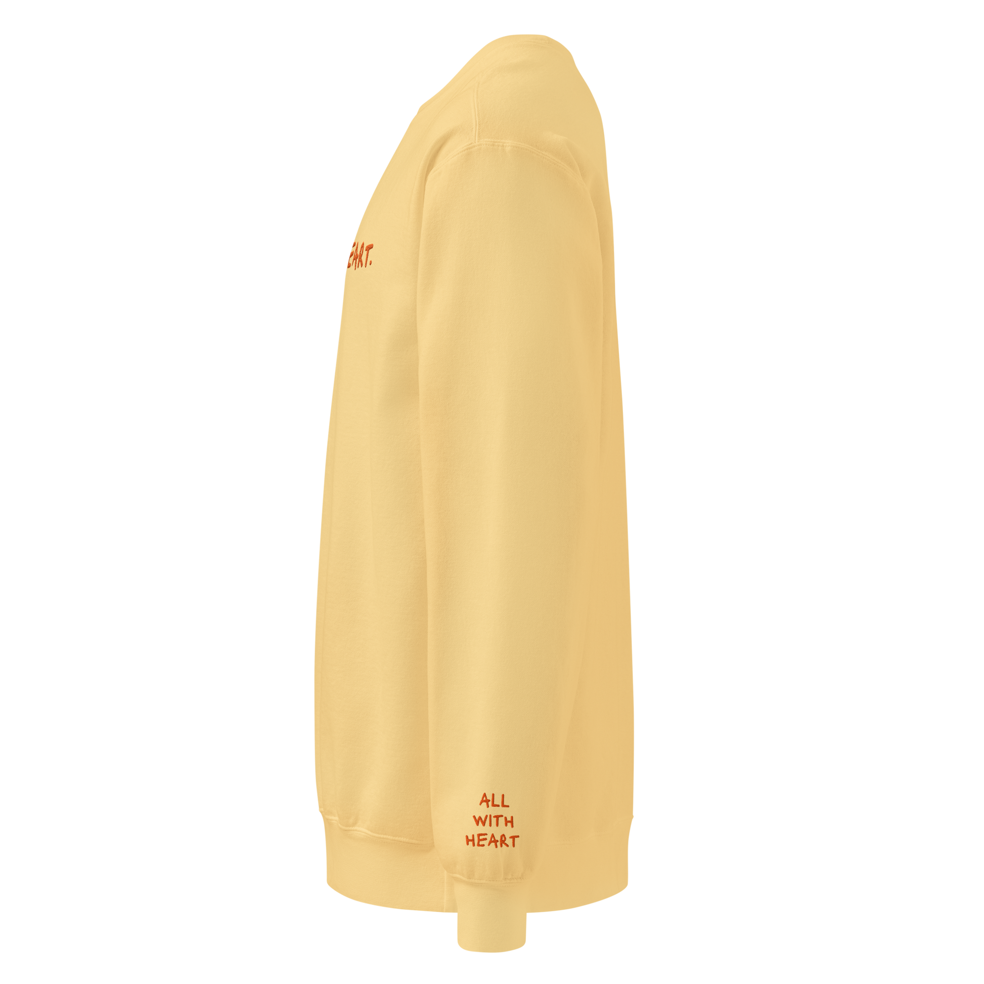 The left side of the All With Heart Crewneck showing All With Heart written on the sleeve.